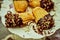 Chocolate dipped madeleines on three tier dessert display plates