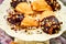 Chocolate dipped madeleines on three tier dessert display plates