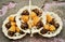 Chocolate dipped madeleines on three tier dessert display plates