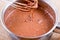 Chocolate dough. Hand mixing brownie`s ingredients in the bowl. Chocolate cake cooking.