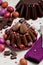 Chocolate Easter cake and Easter eggs colored in purple and brow