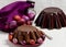 Chocolate Easter cake and Easter eggs colored in purple and brow