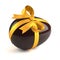 Chocolate easter egg with yellow ribbon