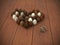 Chocolate Easter eggs heart on brown wooden floor