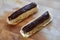 Chocolate eclair, tasty choux dough filled with a cream and topped with chocolate icing