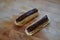 Chocolate eclair, tasty choux dough filled with a cream and topped with chocolate icing