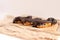 Chocolate eclair on wooden desk food photography. Bekery, cake , choco, pie, confectionary, cream. Three fresh eclairs with chocol