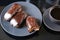 Chocolate eclairs on a plate and cup of coffee. traditional fcench Chocolate Eclairs