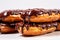 Chocolate Eclairs on a white background, created by Generative AI