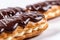 Chocolate Eclairs on a white background, created by Generative AI