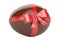 Chocolate egg with bow and ribbon closeup, gift concept. 3D rend