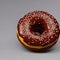 Chocolate-filled glazed donut with sprinkles, delicious baked round dessert, box of donuts, generative ai