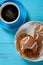 Chocolate flavor cup cakes with a bite and cup of coffee nearby