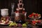 chocolate fountain with melted chocolate and warm gooey goodness, surrounded by fresh fruit