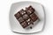 Chocolate Fudge On Plate, White Background. Generative AI