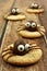Chocolate Halloween spider cookies on rustic wood