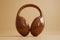 A chocolate headphone set on a brown background - a stylish fashion accessory.