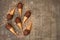 Chocolate ice cream cones with peanuts chips on a metal table