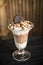 Chocolate ice-cream sundae with buscuit ontop for decor