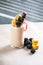 Chocolate indulgent extreme milkshake with macaroons, berry and sweets. Crazy freakshake food trend. Copy space