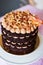 Chocolate layered cake with caramel cream and crispy bacon