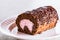 Chocolate log cake rolled with strawberry mouse
