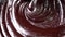 Chocolate melted. Mixing liquid chocolate with a whisk. Prepares dessert. 4K Resolution