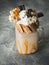 Chocolate milkshake with dripping sauce, cream, waffle and candy bar
