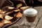 Chocolate mousse with frothy milk in glass with sweet crispy chips