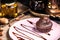 Chocolate muffin on a pink plate in a restaurant