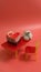 Chocolate muffin with a white chocolate heart on top  on a pink background with space for text. Cake on a toy table from chairs.