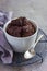 Chocolate muffin in white ramekin
