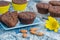 Chocolate muffins on a blue background close-up. Homemade Baking