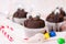 Chocolate muffins with edible eyes and colorful bonbons