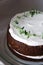 Chocolate Naked Cake with Cream Frosting and Decorated with Fresh Thyme