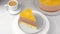 Chocolate-orange mousse cake with biscuit base, jelly and orange circles. Traditional holiday dessert. Piece of cake rotates