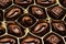 Chocolate over black background. Chocolate Candy Cocoa. Assortment of fine chocolates close up