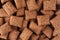 Chocolate pads corn flakes closeup background. Cereals texture.