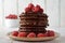 Chocolate pancakes with raspberries