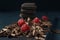 Chocolate pieces with chocolate shavings and raspberry on dark wooden background