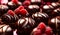 chocolate pralines glistening with a glossy with raspberry, plate of chocolates and raspberries ,pralines background