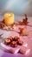 Chocolate pralines with walnut nuts on marble cutting board. Closeup on candy. Autumn arrangement with candle, pumpkins
