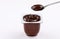 Chocolate pudding cup plastic  with spoon on white background