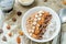 Chocolate quinoa breakfast with coconut shaving, pecan, hazelnut and chocolate slices