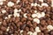 Chocolate raisins and nuts pile sweet background