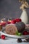 Chocolate roll cake or swiss dessert cake with raspberries. Romantic mood with candles