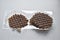 Chocolate round waffle cookies on a white background