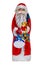 Chocolate Santa isolated. Close-up of a cheerful wrapped chocolate Santa Claus or the good Saint Nicolas figurine isolated on a