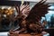 chocolate sculpture of a mythical creature, with wings and horns made from chocolate