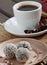 Chocolate sesame sweets and aromatic coffee with spices